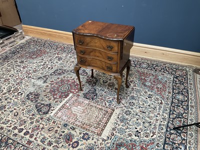 Lot 2585 - A 1950s walnut serpentine fronted drop-leaf...