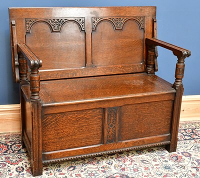 Lot 2431 - A 1920s/30s oak monk's bench with hinged seat,...