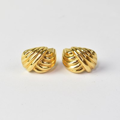 Lot 903 - A pair of yellow metal clip earrings in the...