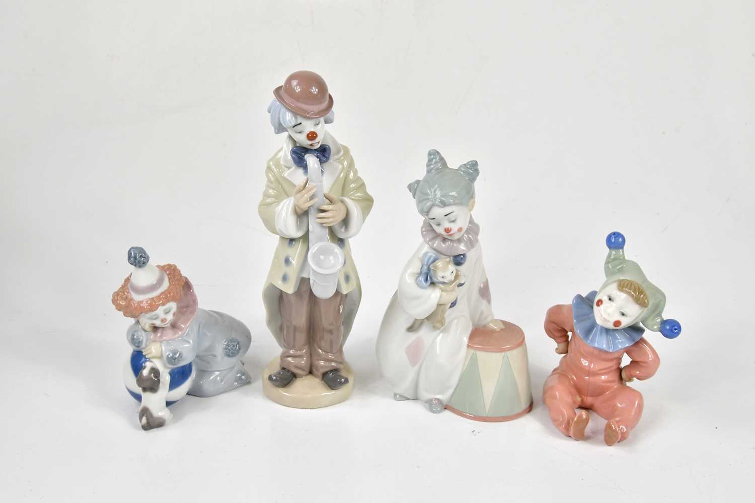 Lot 1427 - LLADRO; three assorted figures to include a...