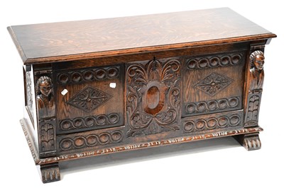 Lot 26 - A mid-20th century carved oak coffer with...