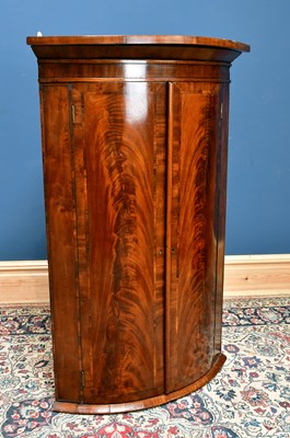 Lot 2481 - An early 19th century mahogany bowfront corner...