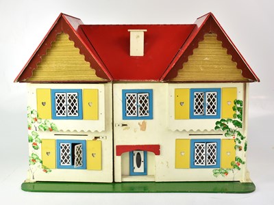 Lot 217 - A mid-20th century dolls house, cream with red...