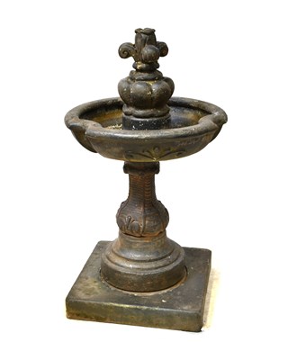 Lot 107 - A cast ceramic fountain with piecrust bowl...