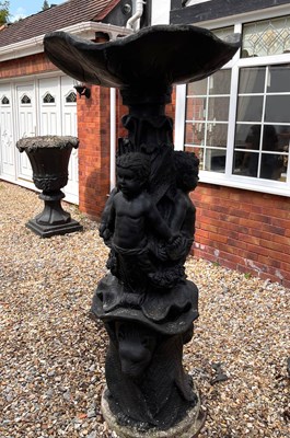 Lot 113 - A black painted composite fountain with...