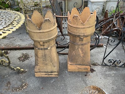 Lot 2382 - Two castle top chimney pots, height 79cm (2).