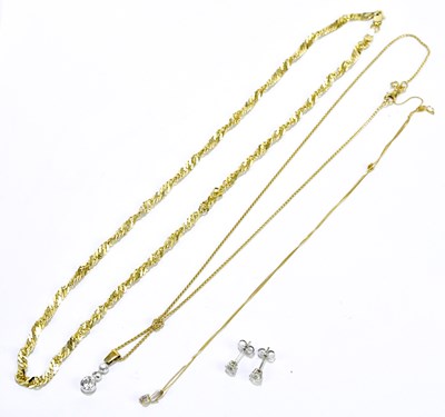 Lot 237 - An 18ct yellow gold chain suspending a diamond...