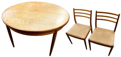 Lot 2538 - G-PLAN; a teak extending circular top dining...
