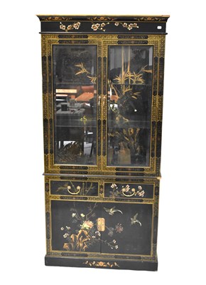 Lot 321 - A Chinese black lacquered glazed bookcase...