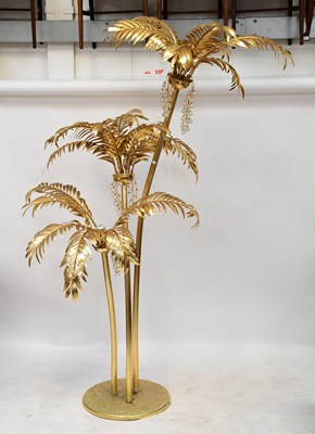 Lot 125 - A brass-effect standard lamp in the form of...