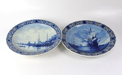 Lot 233 - DELFT; a pair of blue and white chargers, each...