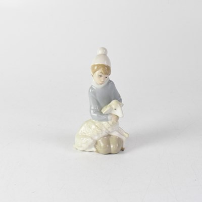 Lot 291 - LLADRÓ; a small figure of a young lady...