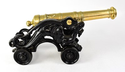 Lot 342 - A brass and cast iron table cannon with...