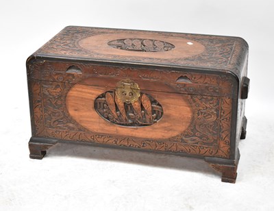 Lot 47 - An early 20th century carved camphor wood...