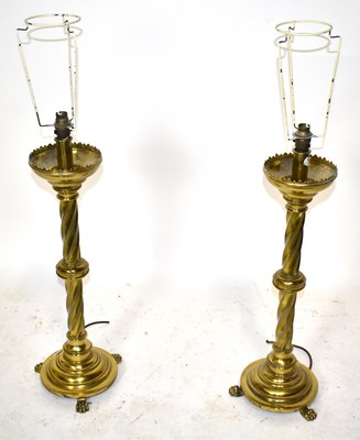 Lot 211 - A pair of brass table lamps.