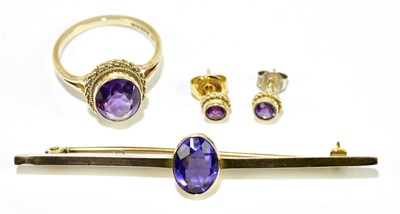 Lot 297 - A 9ct yellow gold and amethyst bar brooch, a...