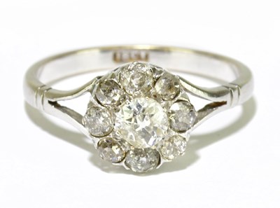 Lot 37 - An 18ct white gold and nine stone diamond...