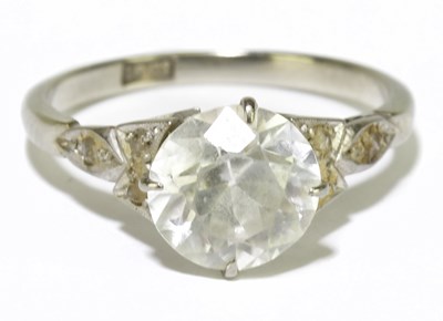 Lot 140 - An 18ct white gold single stone dress ring,...