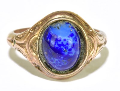 Lot 141 - A yellow metal cabochon set ring, size L 1/2,...