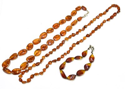 Lot 387 - A reconstituted amber necklace and another and...