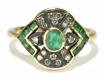 Lot 51 - An 18ct yellow gold emerald and diamond ring...