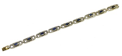 Lot 161 - A yellow metal sapphire and diamond bracelet...