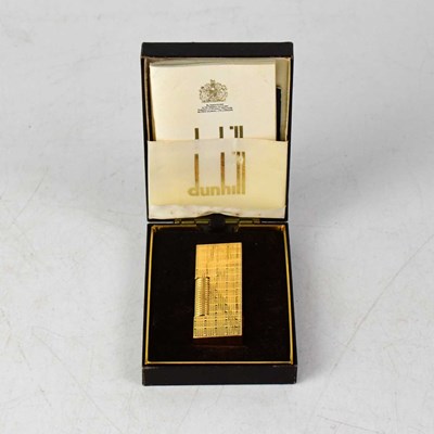 Lot 160a - DUNHILL; a boxed textured gold-plated lighter,...