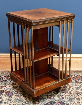 Lot 2447 - A mahogany revolving bookcase, height 82cm.