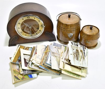 Lot 2094 - An early 20th century oak mantel clock, the...
