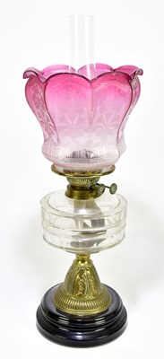 Lot 2344 - A Victorian oil lamp with cranberry and clear...