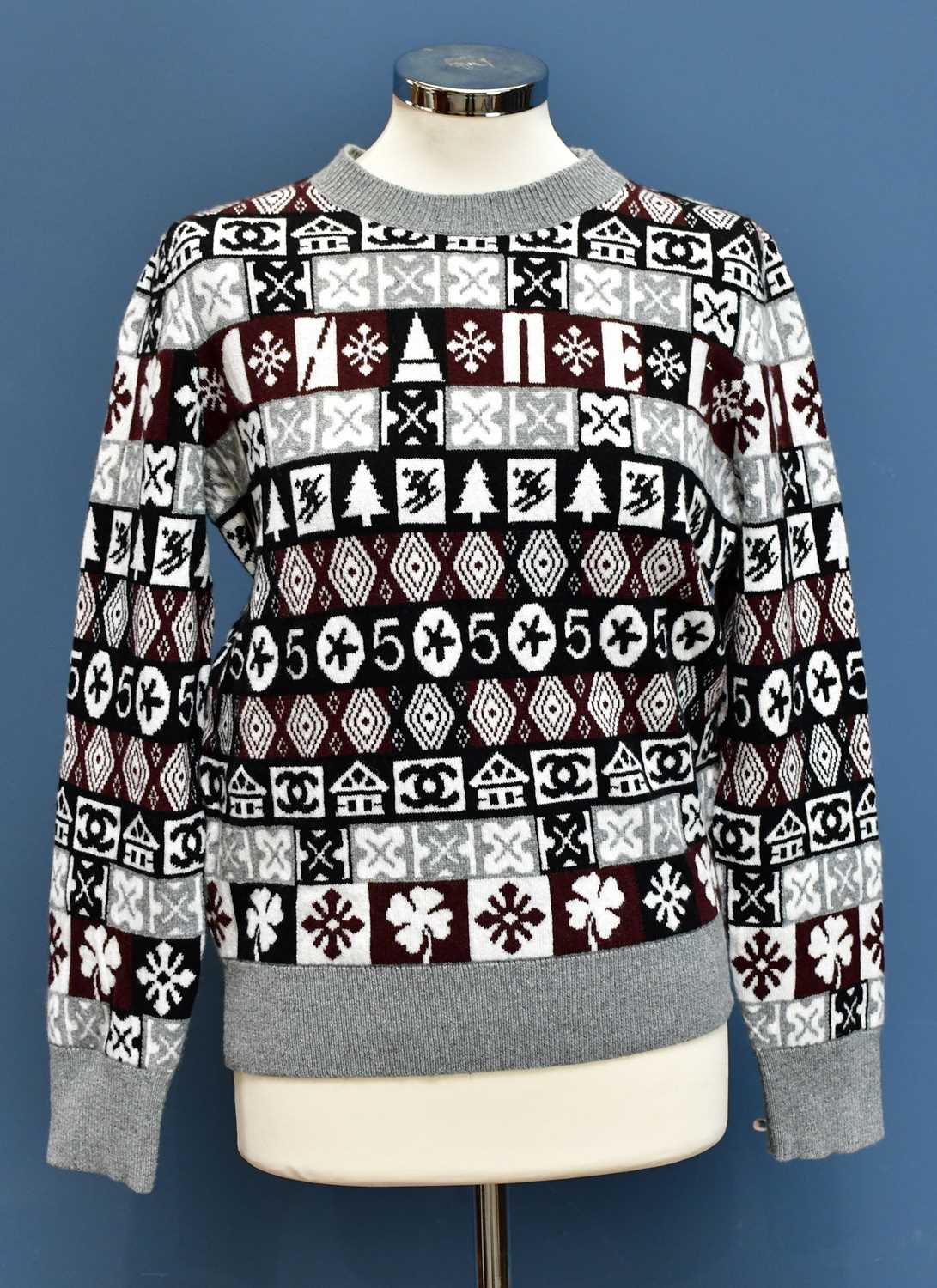 Lot 731 - CHANEL; an unused 100% cashmere snow flake...