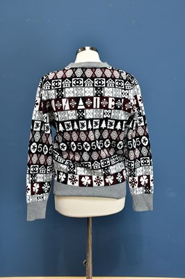 Lot 731 - CHANEL; an unused 100% cashmere snow flake...