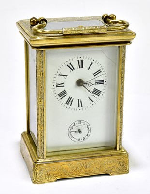 Lot 6382 - A brass repeating carriage clock with allover...