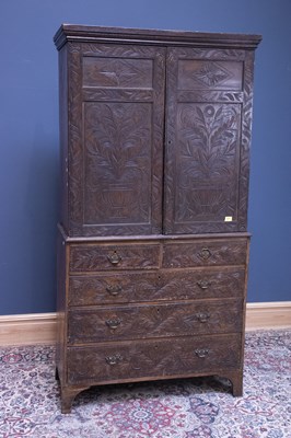 Lot 2374 - A 19th century carved linen press with a pair...