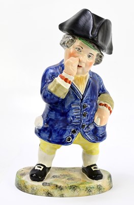 Lot 531 - A Staffordshire type figure of a portly...