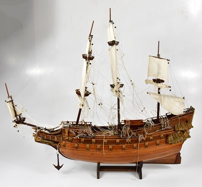 Lot 1091 - A wooden and gilt wood model of HMS VICTORY on...