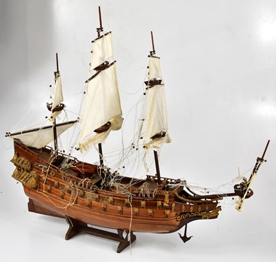 Lot 1091 - A wooden and gilt wood model of HMS VICTORY on...