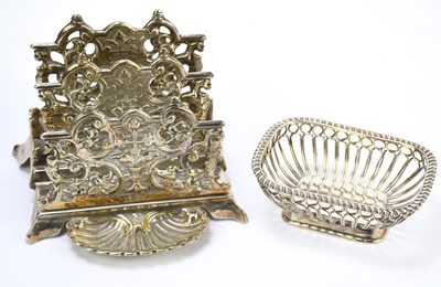 Lot 256 - A silver plated letter rack with pierced and...