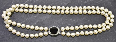 Lot 212 - A two row cultured pearl choker with diamond...