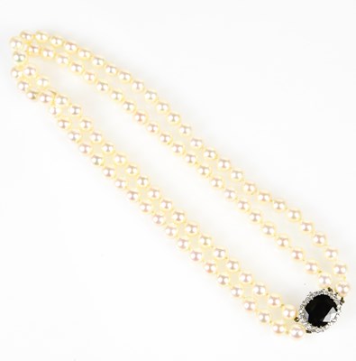 Lot 332 - A two row cultured pearl choker with diamond...