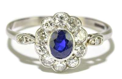 Lot 20 - An 18ct white gold platinum, sapphire, and...