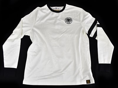 Lot 2236 - FRANZ BECKENBAUER; a signed German retro style...