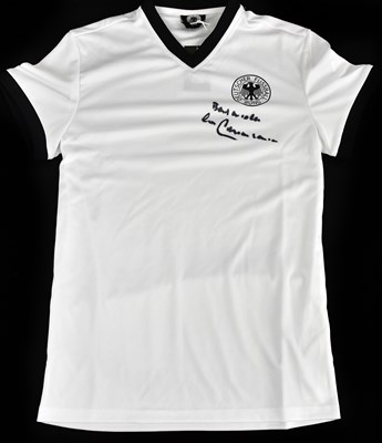 Lot 2197 - FRANZ BECKENBAUER; a signed German retro style...