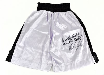 Lot 2217 - MIKE TYSON; a pair of signed shorts, signed...
