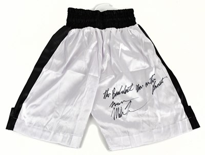 Lot 2218 - MIKE TYSON; a pair of signed shorts, signed...