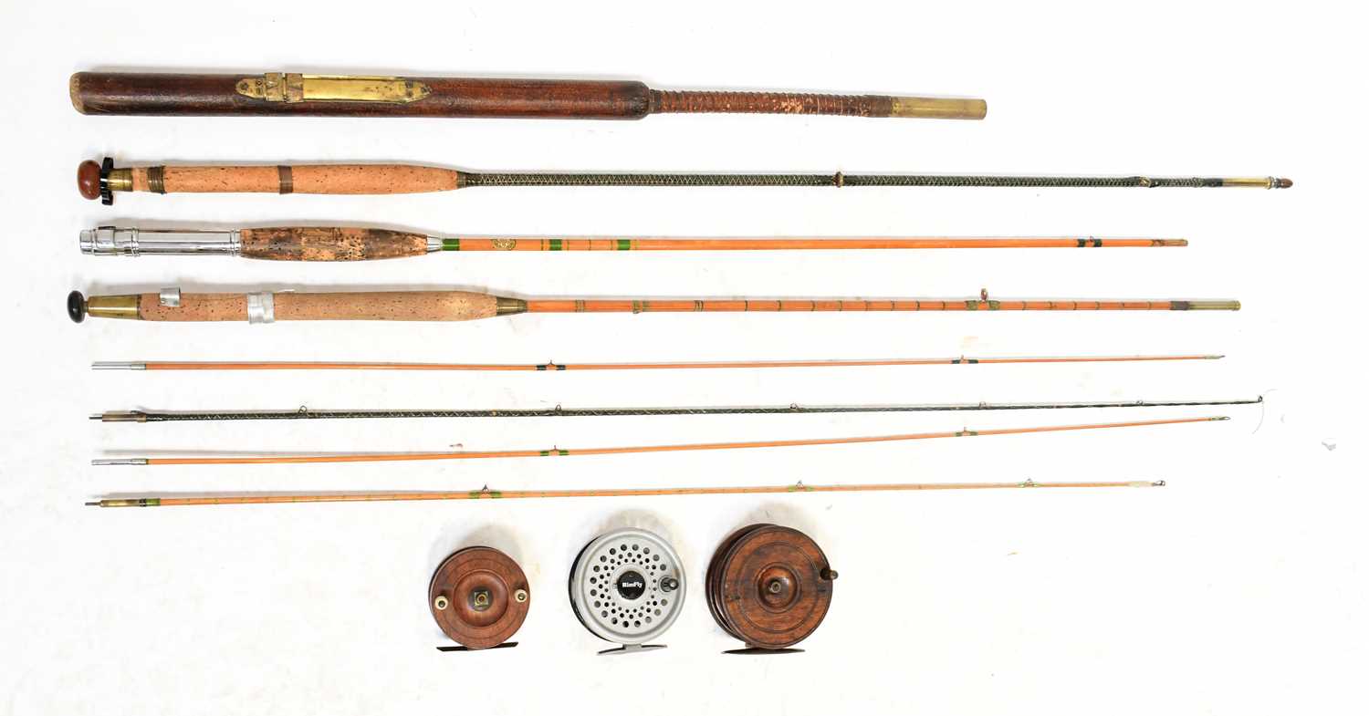 Lot 672 - Four vintage fishing rods including two split...