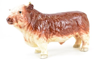 Lot 202 - A vintage butcher's pottery countertop bull,...