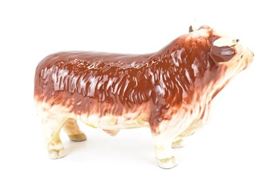 Lot 202 - A vintage butcher's pottery countertop bull,...