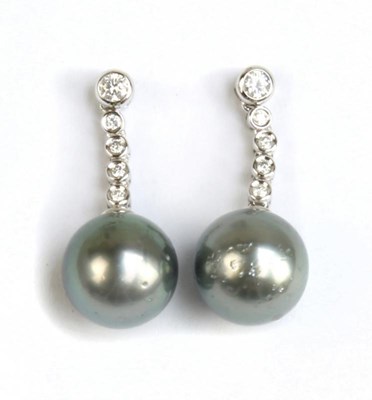Lot 321 - A pair of 14ct white gold diamond and cultured...