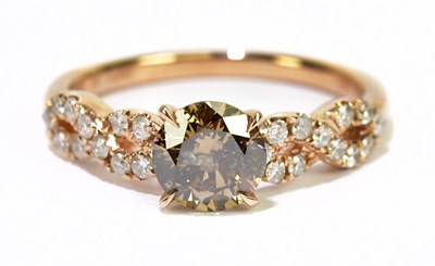 Lot 16 - A 14ct rose gold and diamond ring, the central...